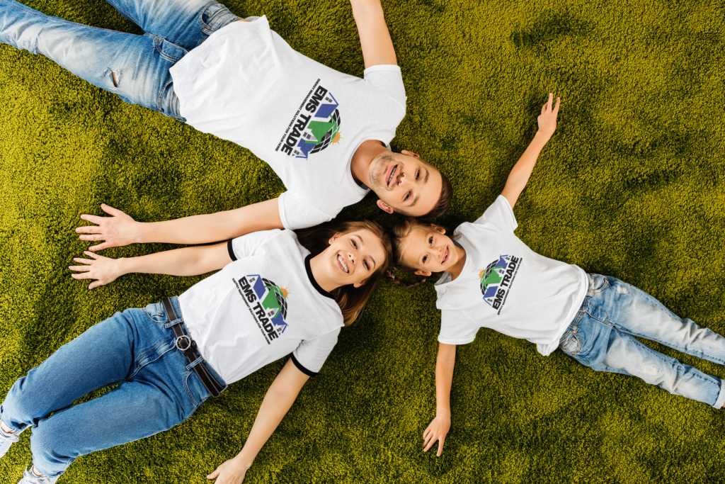 image of a family laying on the ground wearing EMS Trade merchandise